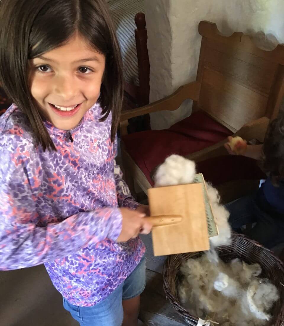 Payton learning how to gather sheep's wool