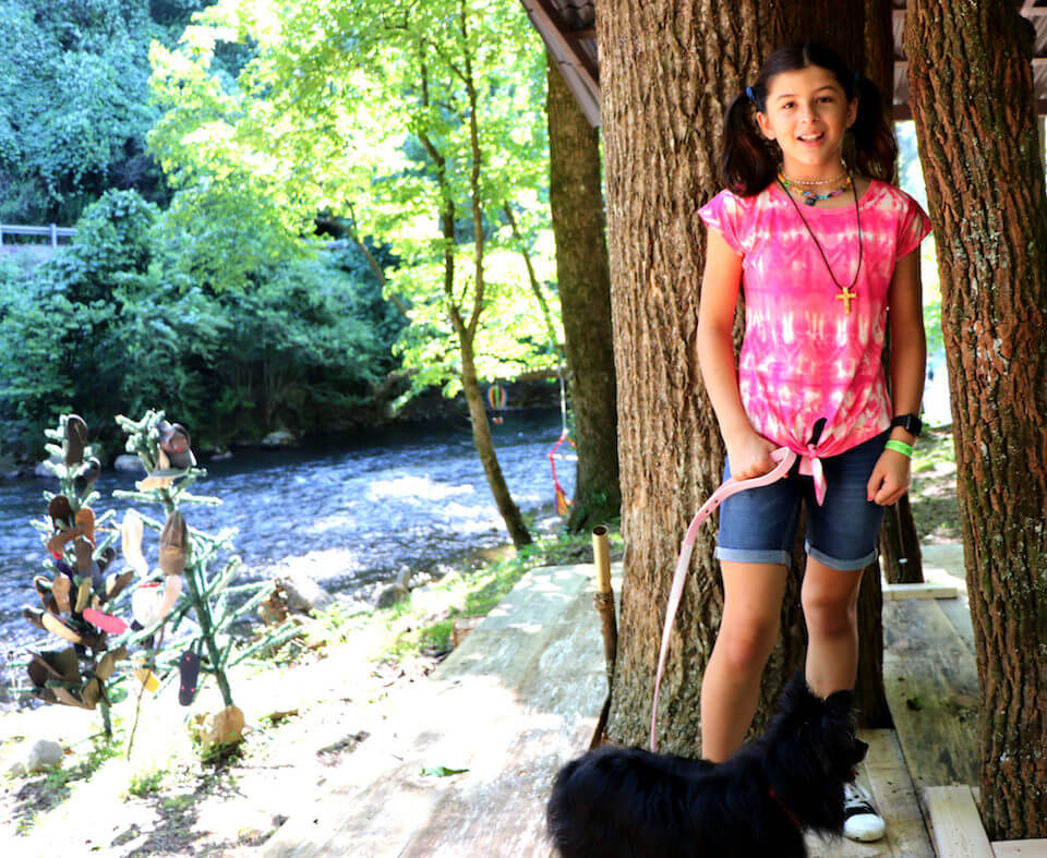 Payton and dog by the river