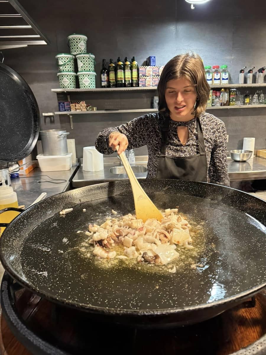Payton helping to cook the Paella